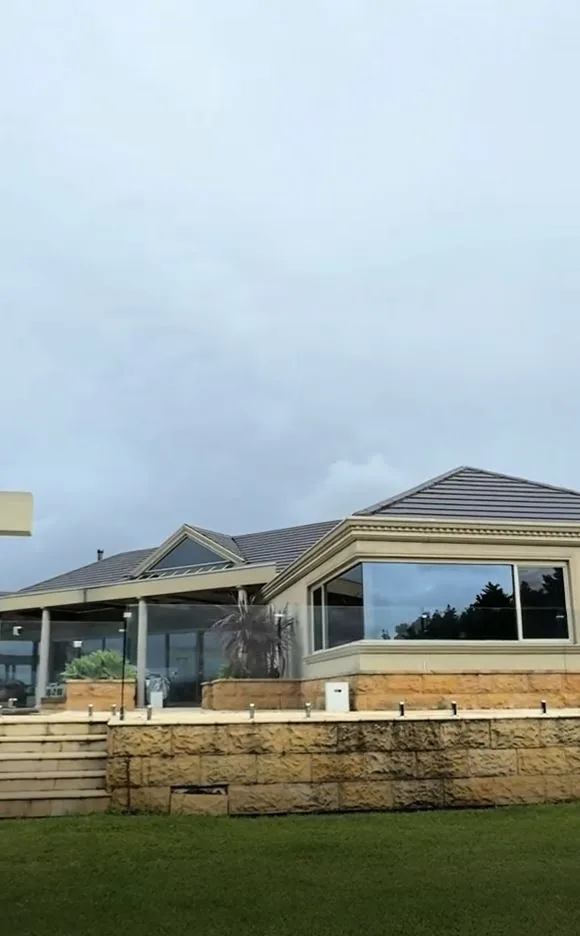 Commercial storefront glazing finished with reflective window film