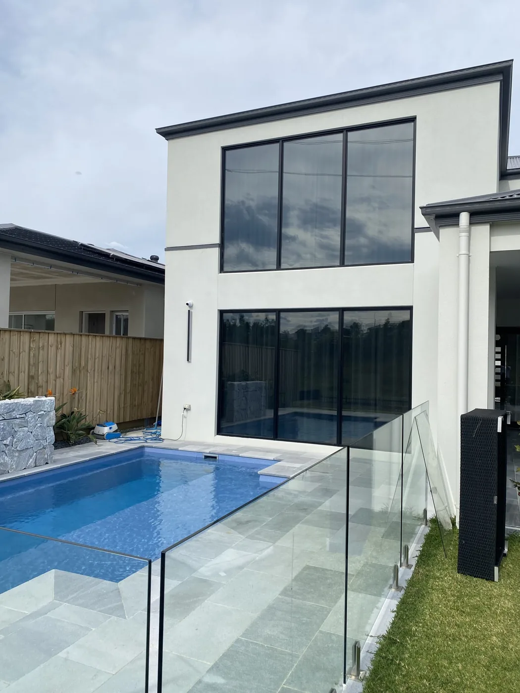 Tinted sliding doors keeping afternoon sun out of a family living area
