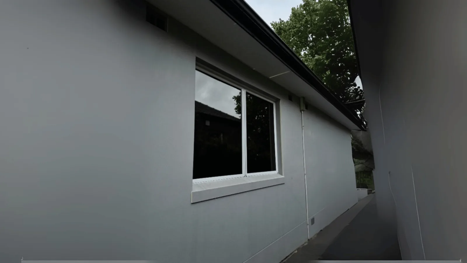 The same window after dark black privacy film, with glare removed and the view intact